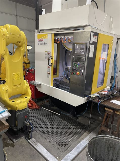 cnc manufacturing cell|fanuc cnc robots.